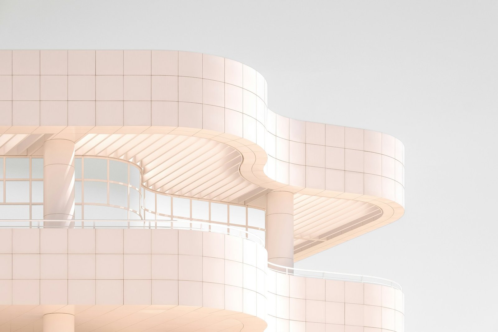 Sculptural ivory architecture curving toward the sky in warm light